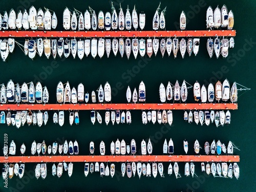 Aerial view of marina with boats and yachts in Italy.