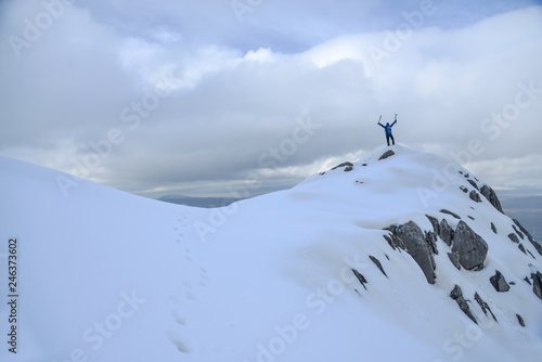 crazy lonely mountain climber and winter hiking adventure on the peaks of the Snowy Mountains