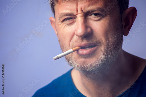 Close up of Man smoking cigarette. People and healt care concept