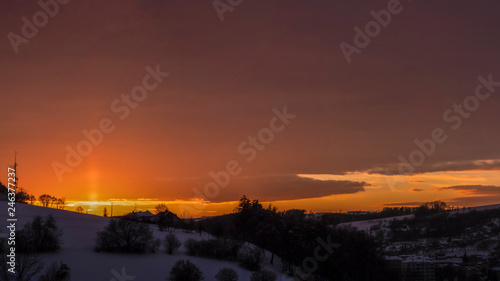 The view on purpur sunset at the snow at the winter and pink sky as reflection of the light. © Sergii