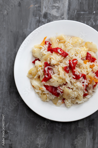 rice with cod fish and red pepper on white dish