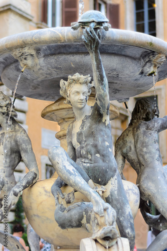 Roman sculpture located in the fountain in Rome