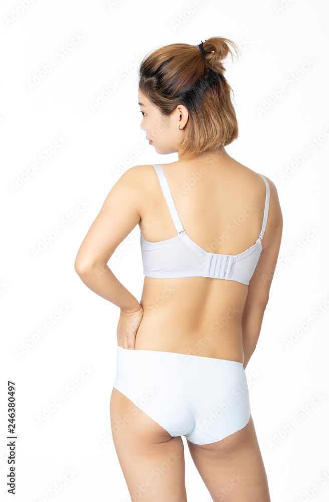 Chinese woman posing in panties and bra on white background Stock