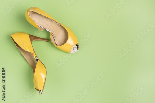 Elegant Yellow Female Leather Shoes on Summer Green Background Flat Lay Top Vew Copy Spac Sales Fashion Concept Horizontal Copy Space