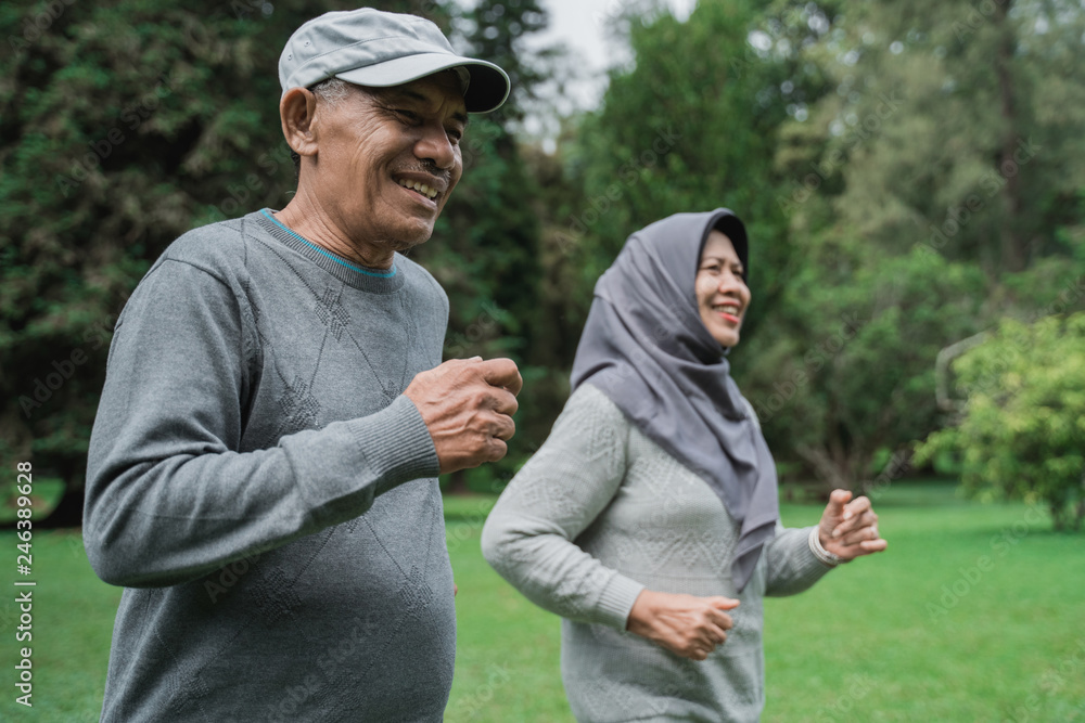 couple doing exercising by running in the garden couple doing exercising by running in the garden