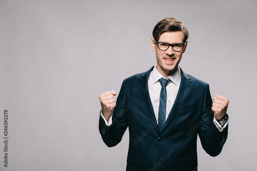 excited businessman celebrating victory isolated on grey excited businessman celebrating victory isolated on grey