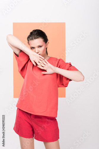 beautiful fashionable girl posing with living coral on background