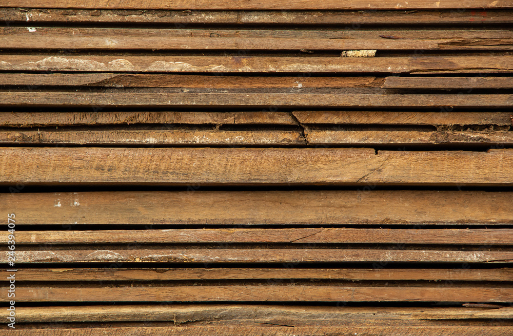 Background and Wallpaper or texture of wood edge lumber is stacked in layers that is ready for use for building a house. Background and Wallpaper or texture of wood edge lumber is stacked in layers that is ready for use for building a house.