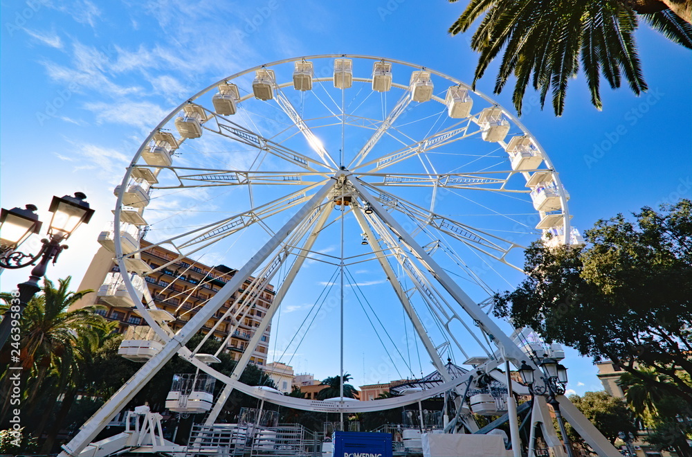 Taranto white ferris wheel in city center, January 2019, Puglia, Italy Taranto white ferris wheel in city center, January 2019, Puglia, Italy