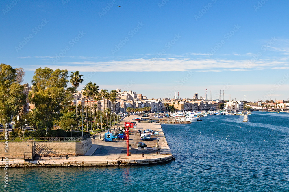 Taranto old town waterfront view on the sea front, steel plant on the background