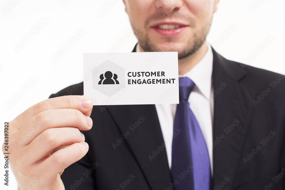 Business, technology, internet and networking concept. Young entrepreneur showing keyword: Customer engagement Business, technology, internet and networking concept. Young entrepreneur showing keyword: Customer engagement