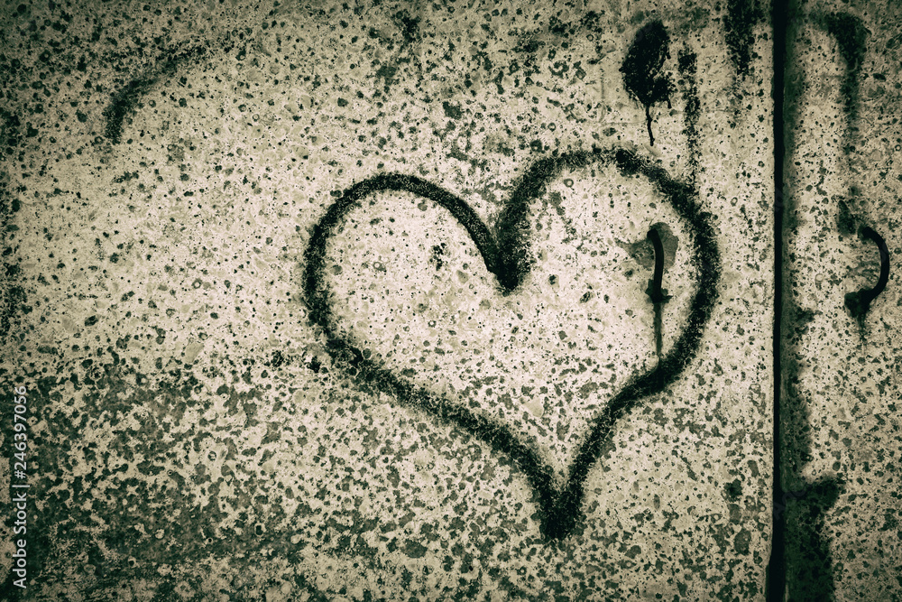 Black Heart painted on a concrete wall. Depression. Valentine's day Black Heart painted on a concrete wall. Depression. Valentine's day