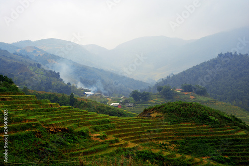 Beautiful landscape with green field on mountains and cloudy sky in Sa Pa, Vietnam