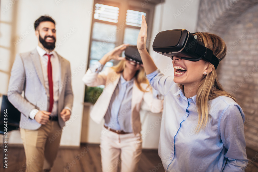 Business people making team training exercise during team building seminar using VR glasses
