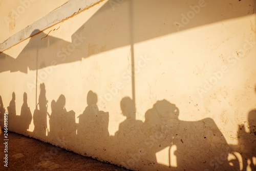Shadows of people on the terrace of a bar