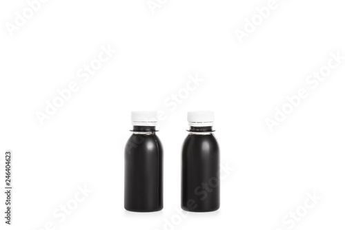 Two black plastic bottles isolated on white