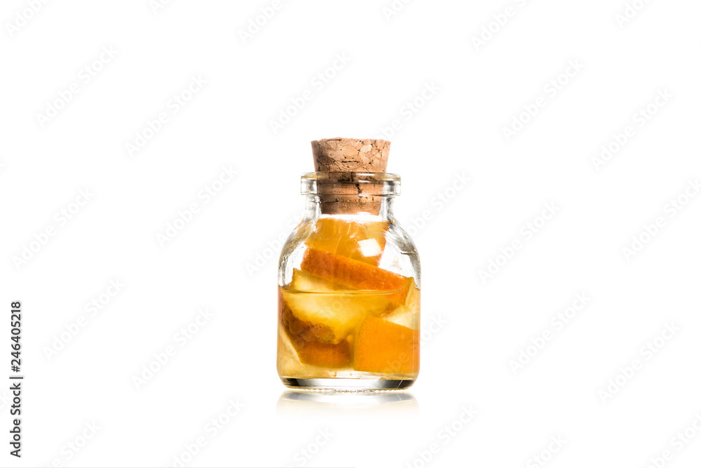 Studio shot of glass jar with fruit pieces isolated on white