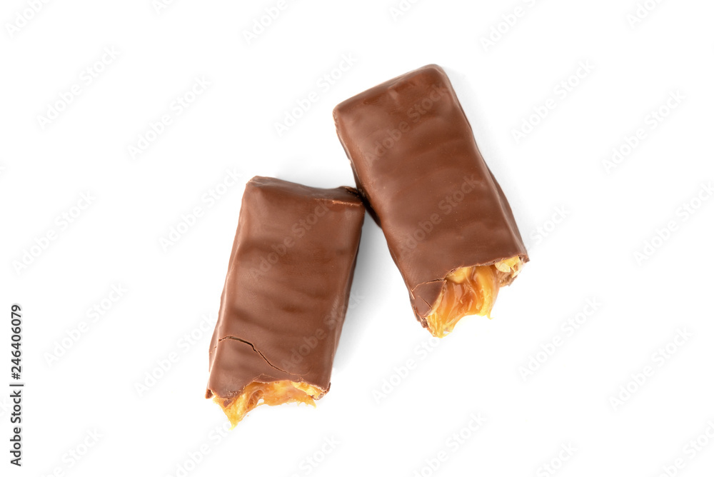 Chocolate bar with caramel and peanut isolated on white background. Chocolate bar with caramel and peanut isolated on white background.
