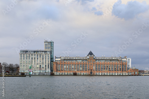 Industrial buildings in a harbor of Amsterdam, Netherlands © castenoid