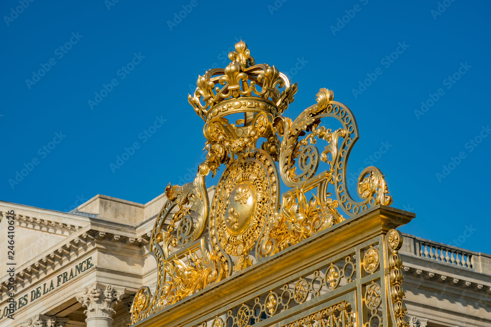 The golden entrance gate of the famous Palace of Versailles