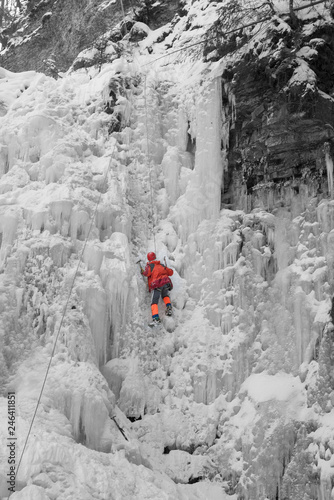 Athletes at Manyavsky Falls in Winter photo