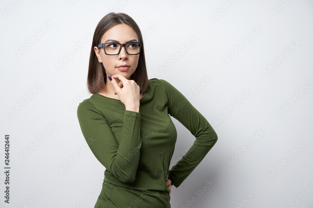 Confident woman in glasses looking to side Confident woman in glasses looking to side