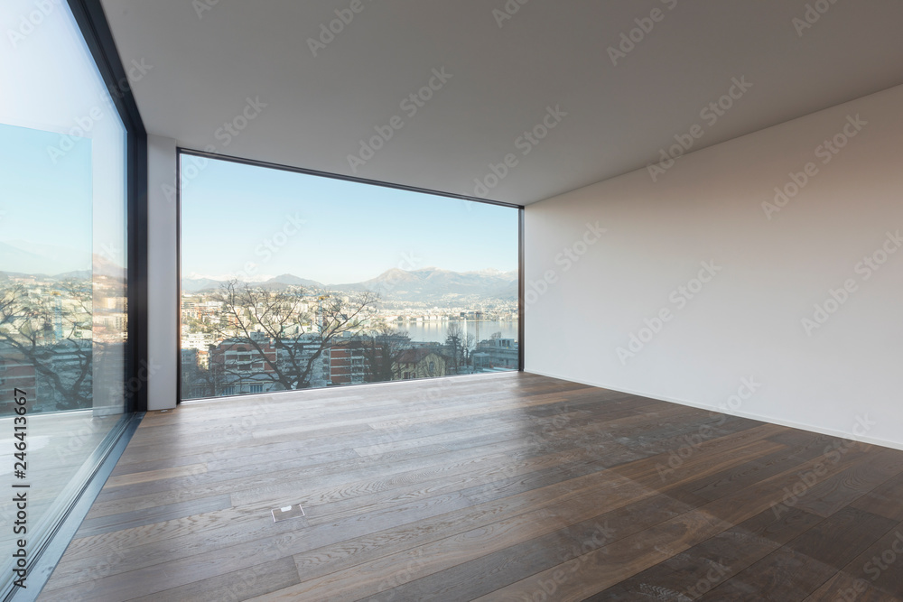 Fototapeta premium Modern white apartment with parquet floors and large windows
