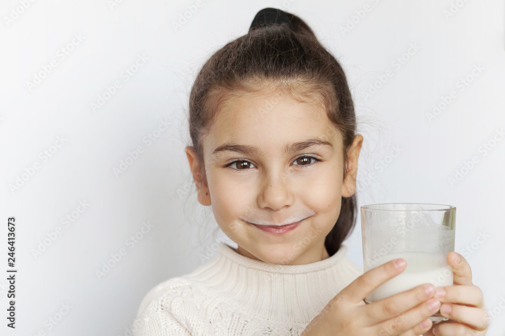 Happy child girl drinking pure water from glass. Happy child girl drinking pure water from glass.