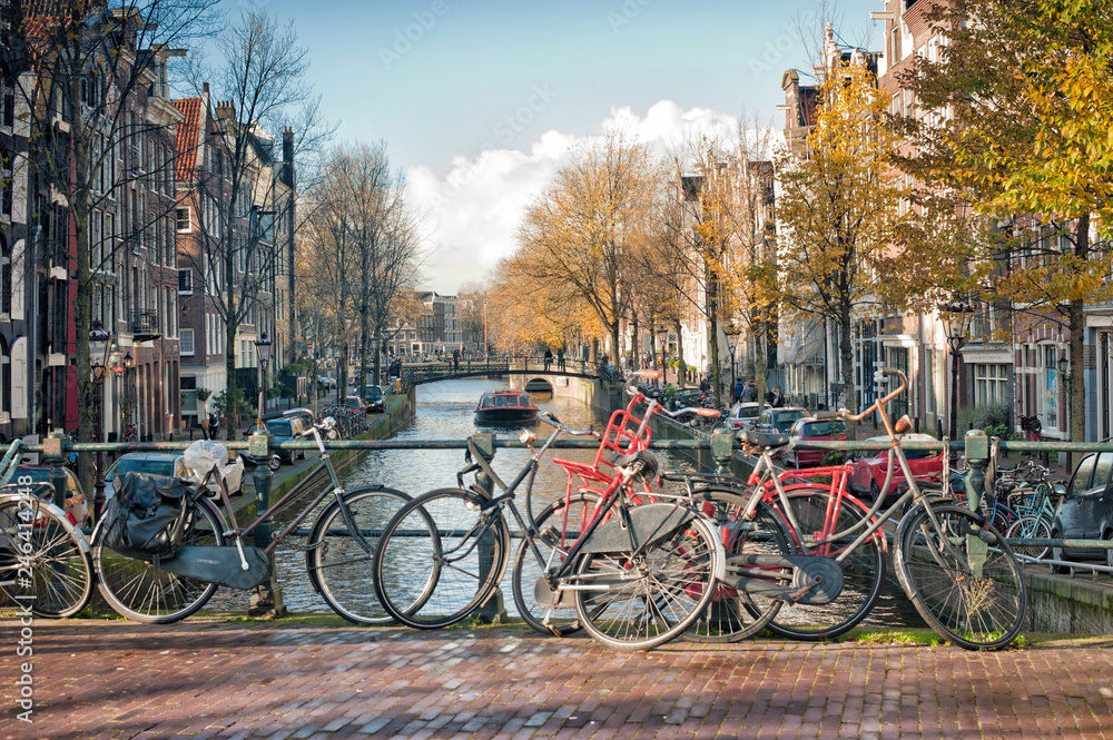 Scenic of  bridge with bicycles parked over the canals of Amsterdam, Netherlands.