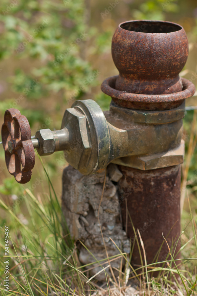 Old pipe with closing faucet Old pipe with closing faucet
