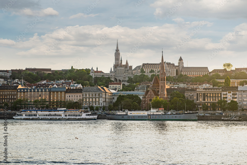 Obraz premium Budapest is the capital of Hungary.Beautiful big old town.The magnificent city is rich in history.The photo is made on a sunny day.City landscape with a wide large river.Beautiful buildings.Landscape.