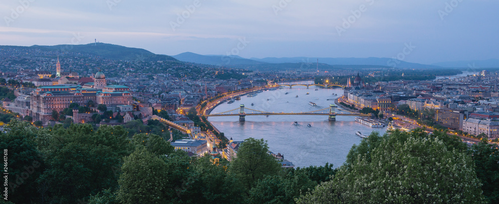 Panorama of Budapest's evening.Capital of Hungary.Beautiful big old town.The photo is made in the dark.The magnificent city is rich in history.City landscape with a wide large river. Golden city.