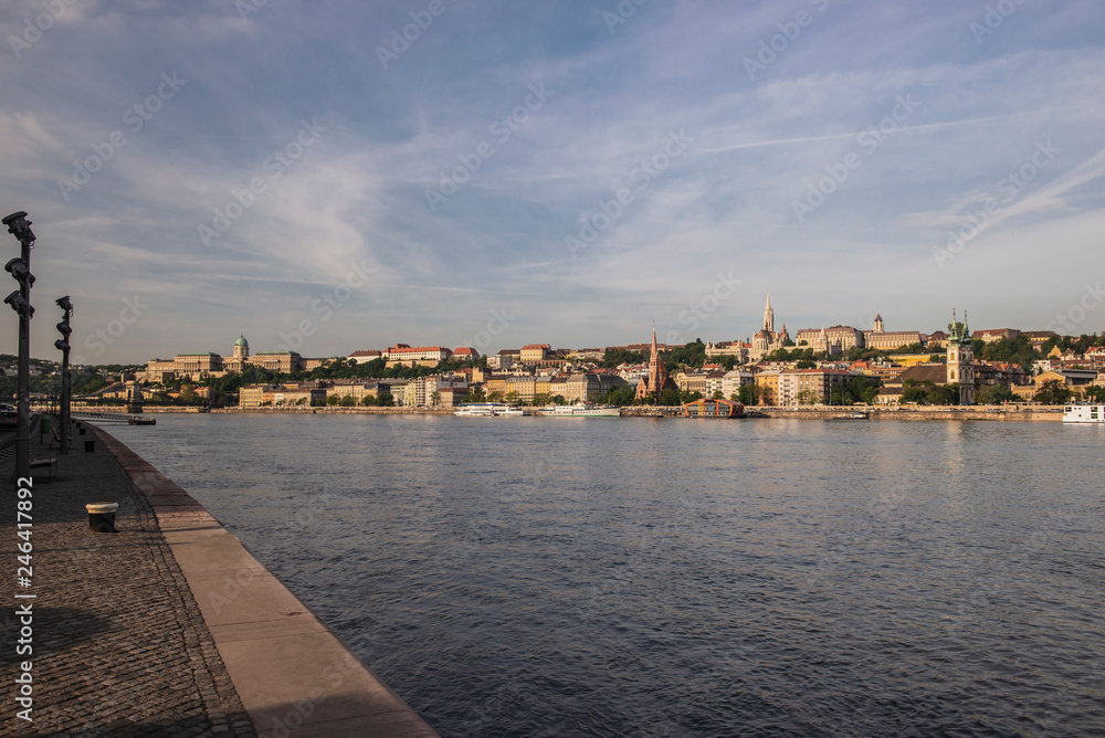 Obraz premium Budapest is the capital of Hungary.Beautiful big old town.The magnificent city is rich in history.The photo is made on a sunny day.City landscape with a wide large river.Beautiful buildings.Landscape.