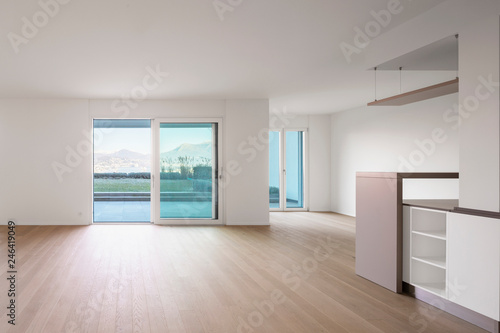 Modern living room with white walls  parquet and windows