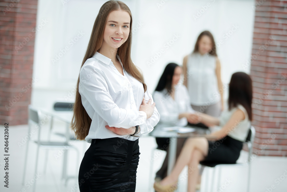 smiling business woman on the background of the office smiling business woman on the background of the office