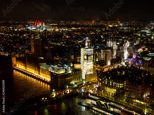 Aerial view at night of Houses of Parliament and The Big Ben clock tower under repair and maintenance  London  England  United Kingdom