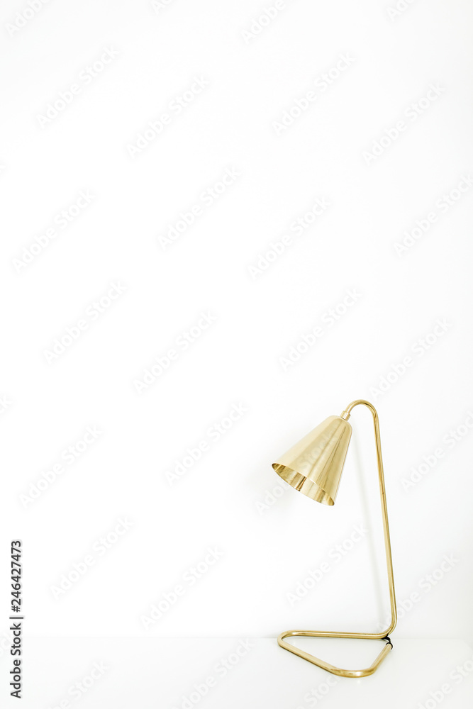 Golden lamp on white background. Minimal concept. Golden lamp on white background. Minimal concept.