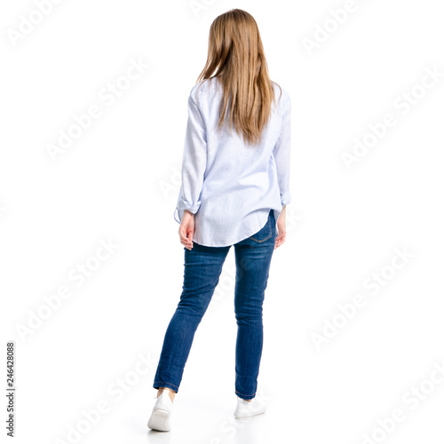 Woman in jeans and blue shirt goes on white background isolation, top view