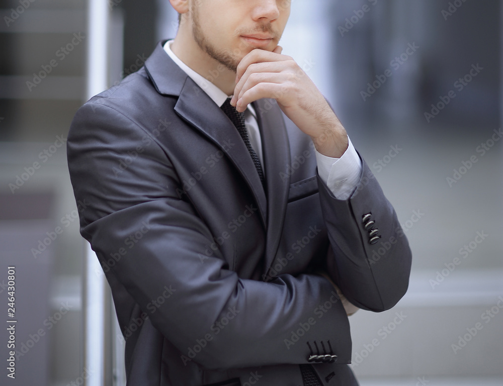close up.portrait of a thoughtful businessman in his office close up.portrait of a thoughtful businessman in his office