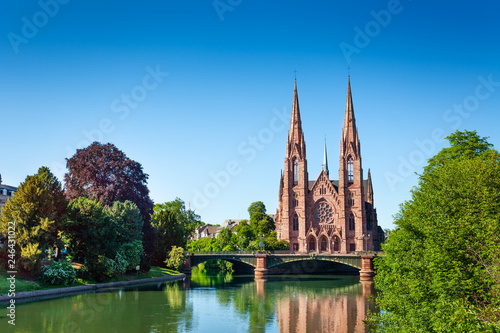 Ill river bank and Saint Paul Church in Strasbourg