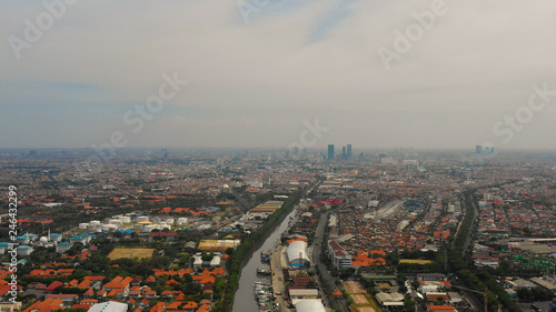 Aerial cityscape densely built asian city, seaport. urban environment in asia. modern city Surabaya with buildings and houses. Surabaya capital city east java, indonesia