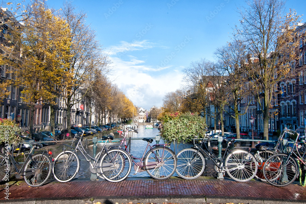 Bicycles lining a bridge over the canals of Amsterdam, Netherlands. Bicycles lining a bridge over the canals of Amsterdam, Netherlands.