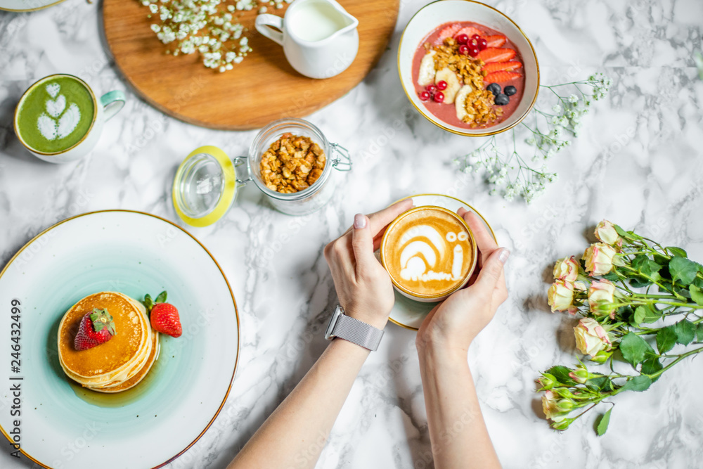 custom made wallpaper toronto digitala cup of coffee with milk in hand, pancakes and cereal with fruit on the table