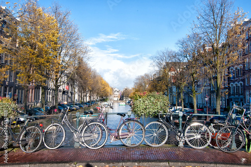 Bicycles lining a bridge over the canals of Amsterdam, Netherlands.