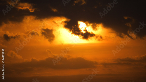 Sunset, sunrise with clouds. orange skies and sun © Alex Traveler