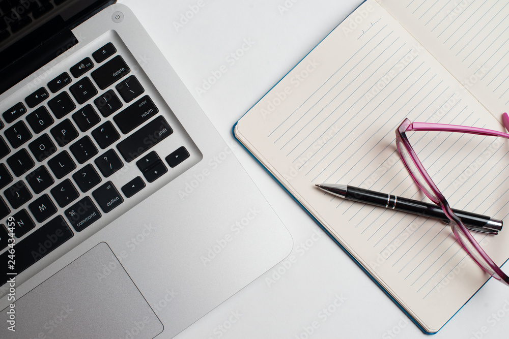 Notebook with black pen, Colorful notepads on the desk, Glasses on the desk with pen and cup of coffee, Computer keyboard with colorful note stick Notebook with black pen, Colorful notepads on the desk, Glasses on the desk with pen and cup of coffee, Computer keyboard with colorful note stick