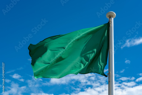 green flag under the sky