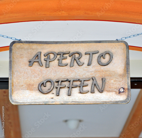 Open sign on italian and german languages photo