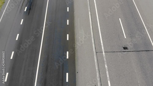Wallpaper Mural Aerial Top view of the wet freeway. Moving cars on a wet road, shooting from a dron. Aerial landscape Torontodigital.ca