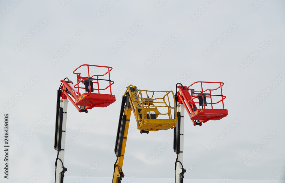 Universal lifting baskets for installation works yellow and red. Universal lifting baskets for installation works yellow and red.